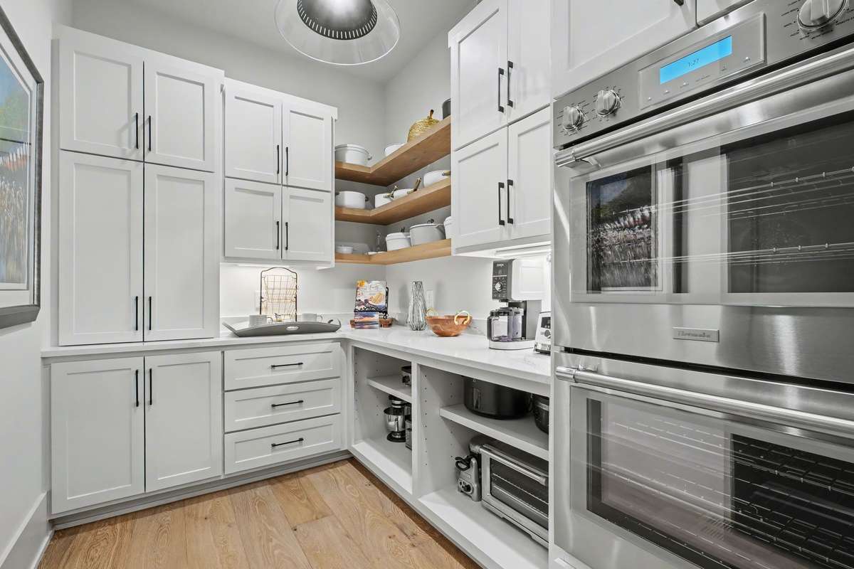 The Scullery Area located steps from the Primary Area of the Kitchen with Double Ovens is a very Unique Space and Design - Gotta see this!