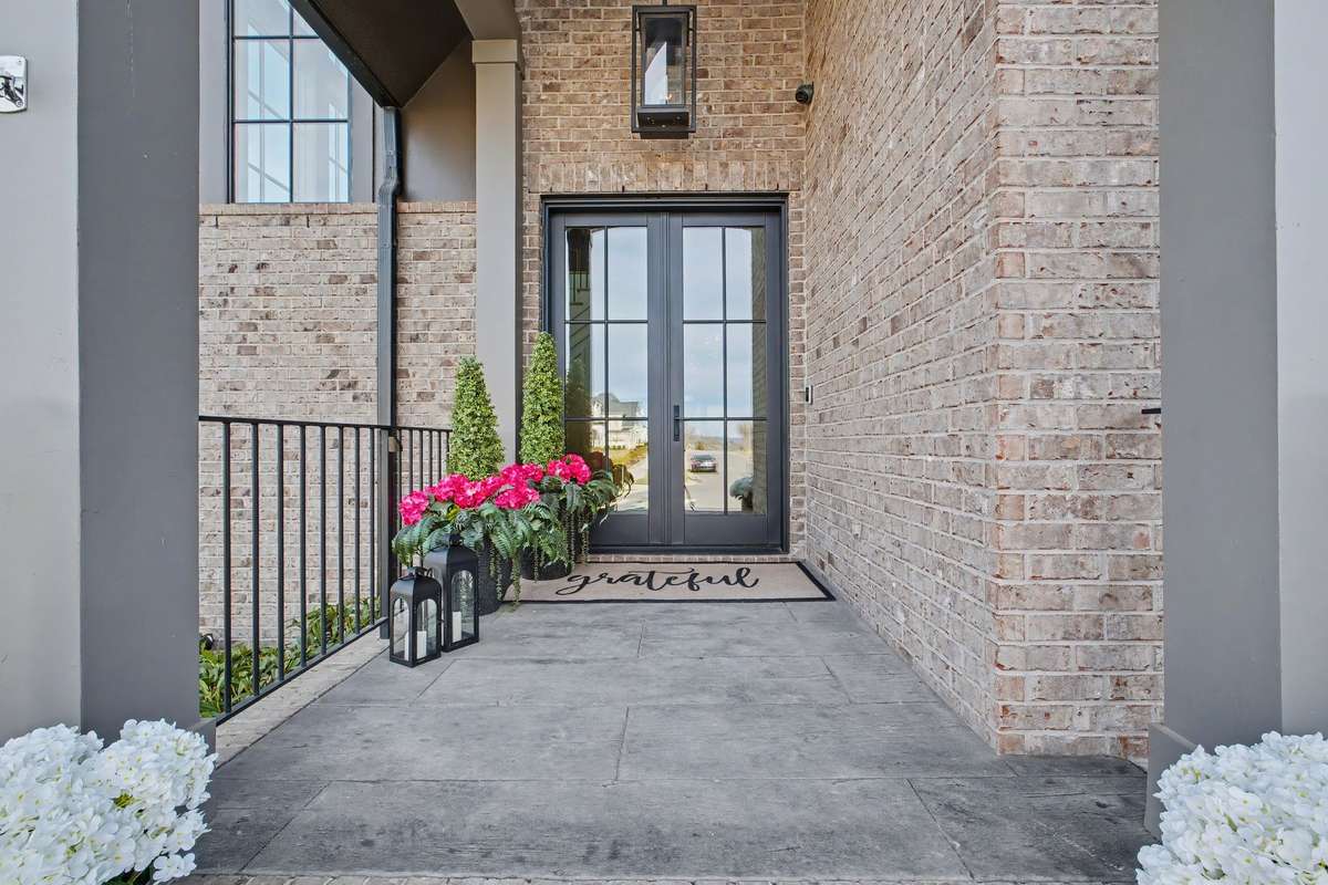 Inviting & Covered Front Porch with Double Steel Front Doors