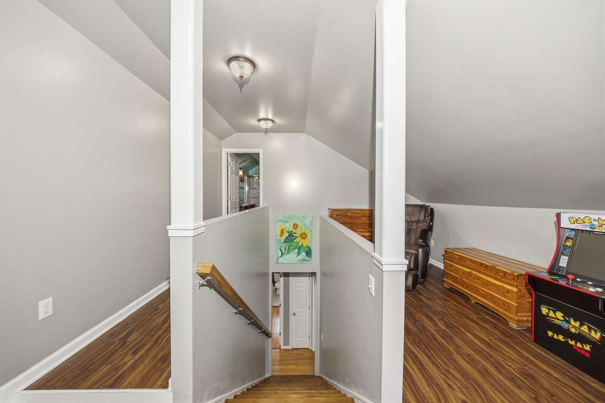 Upstairs offers another hobby room or tons of extra storage space.