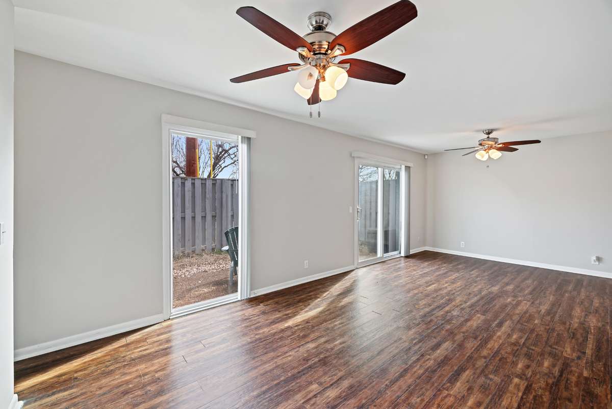 Private and fenced patio can be accessed through both the living room and the dining room