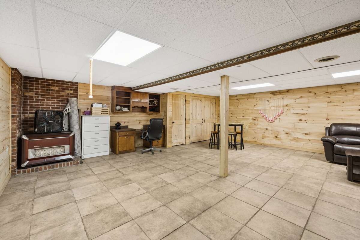 Downstairs finished basement with wood-burning stove and build in desk