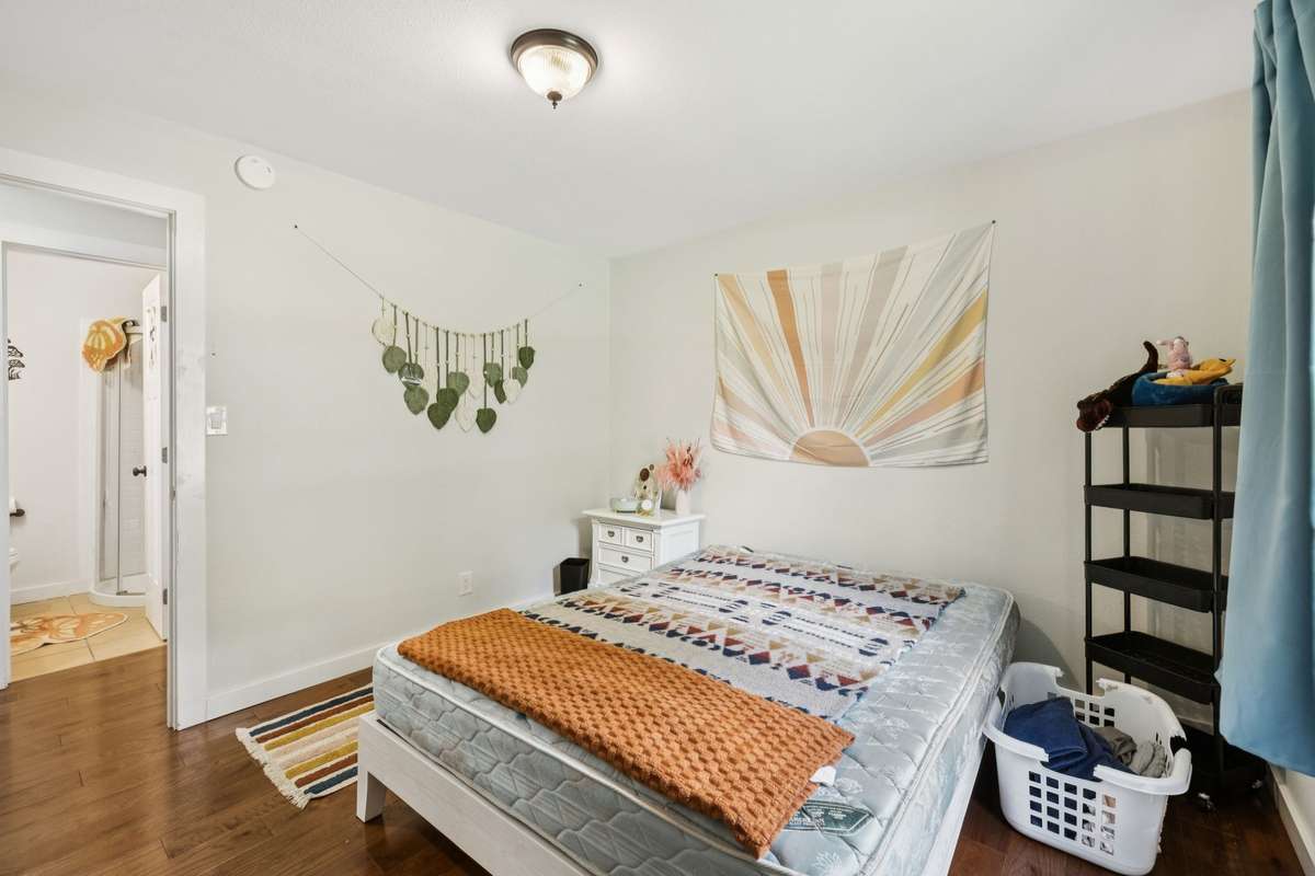 Large upstairs bedroom with view of full bathroom