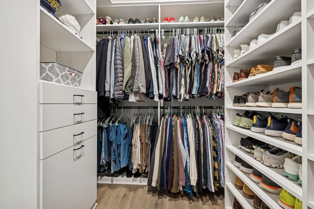 This closet, installed by Closet by Design, maximizes space and adds a luxury feel,