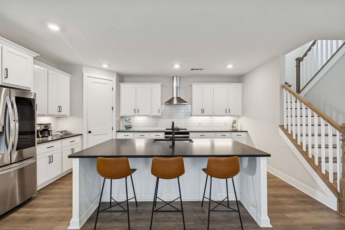 Recessed lighting, stainless appliances, stainless vented hood.