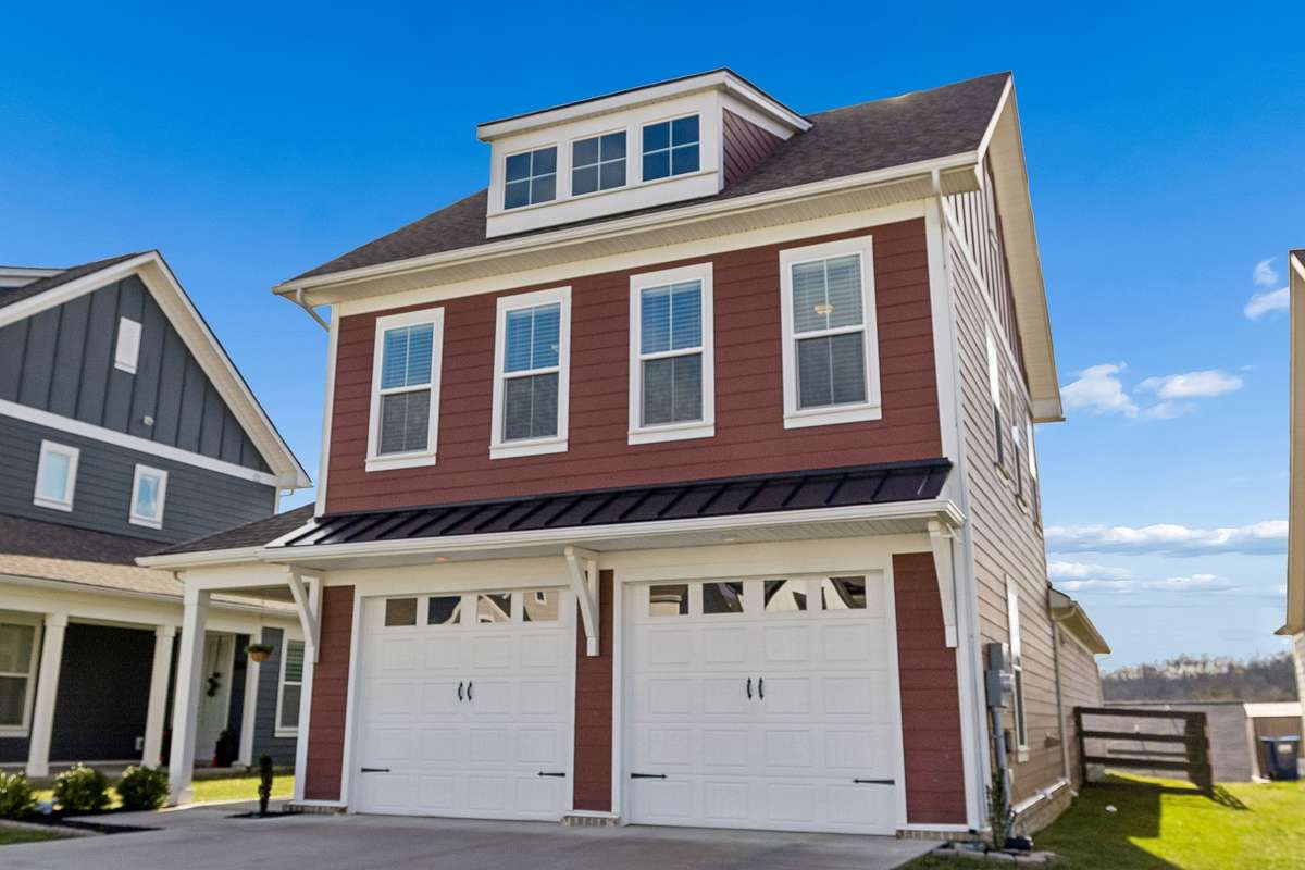 Level driveway and two car garage provides ample parking.