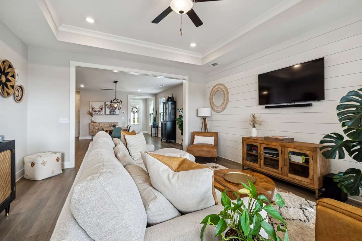 Living room is open to the dining area and entry.