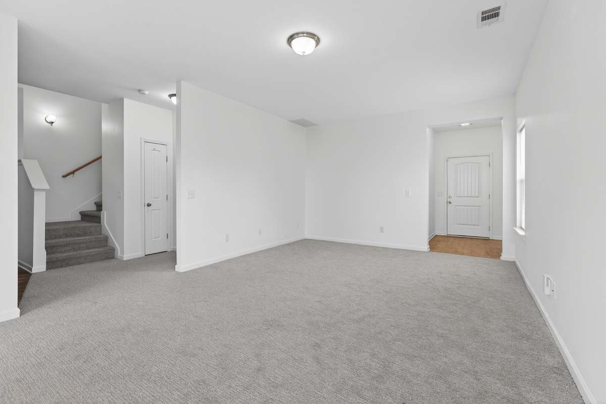 The stairway leads to 3 bedrooms upstairs!