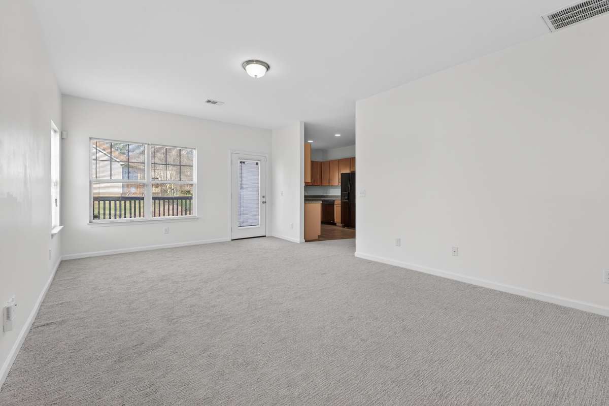 Spacious Living Area with door leading to the large back deck!