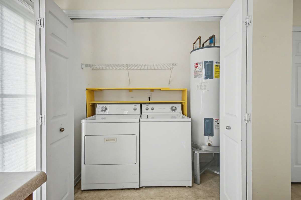 Washer/dryer in utility room just as you enter the back door in the kitchen.