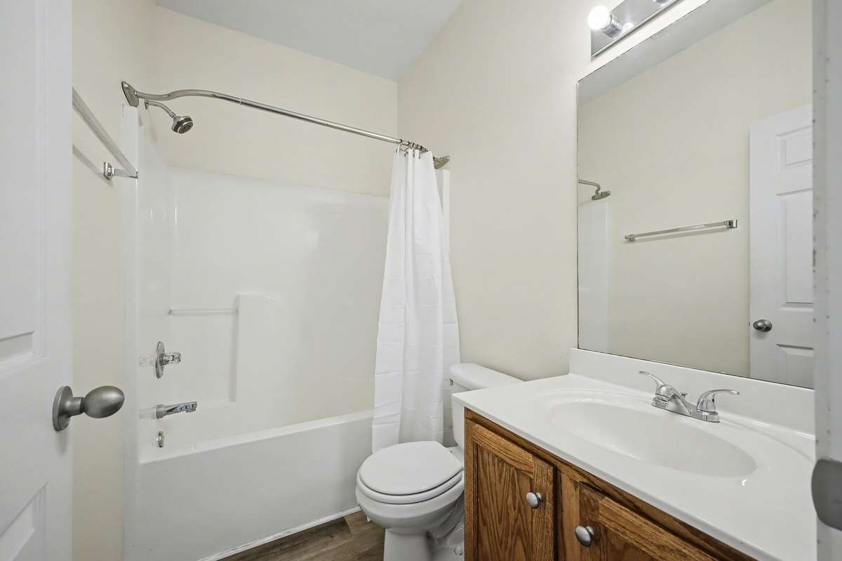 Hall bath with combo tub/shower.