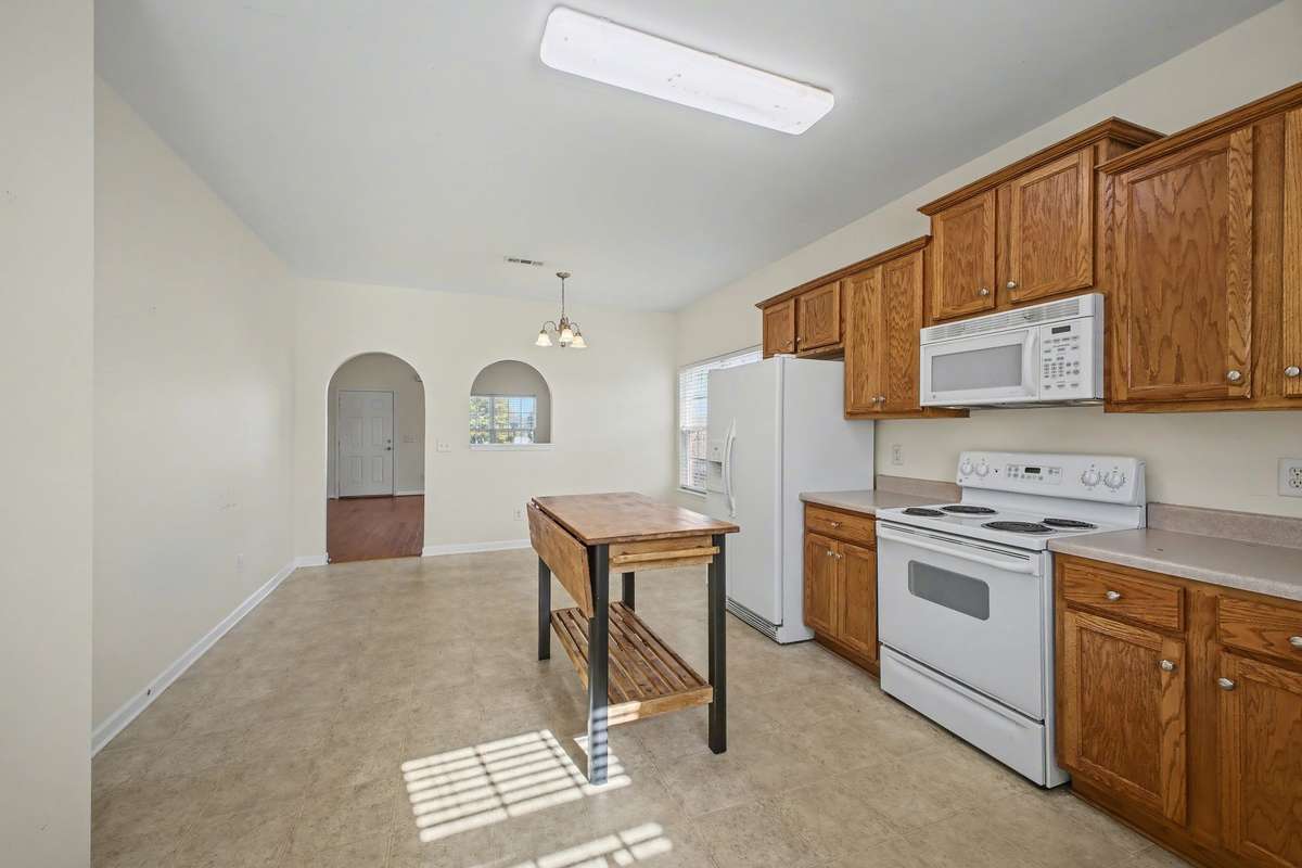 Kitchen comes with refrigerator, stove, dishwasher, microwave and disposal.