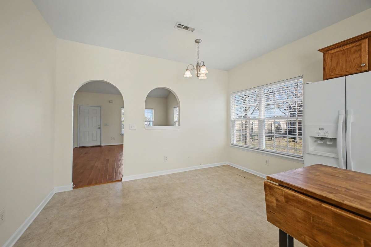Eat-in area joins the living room.  Lot's of windows bring in the natural light.