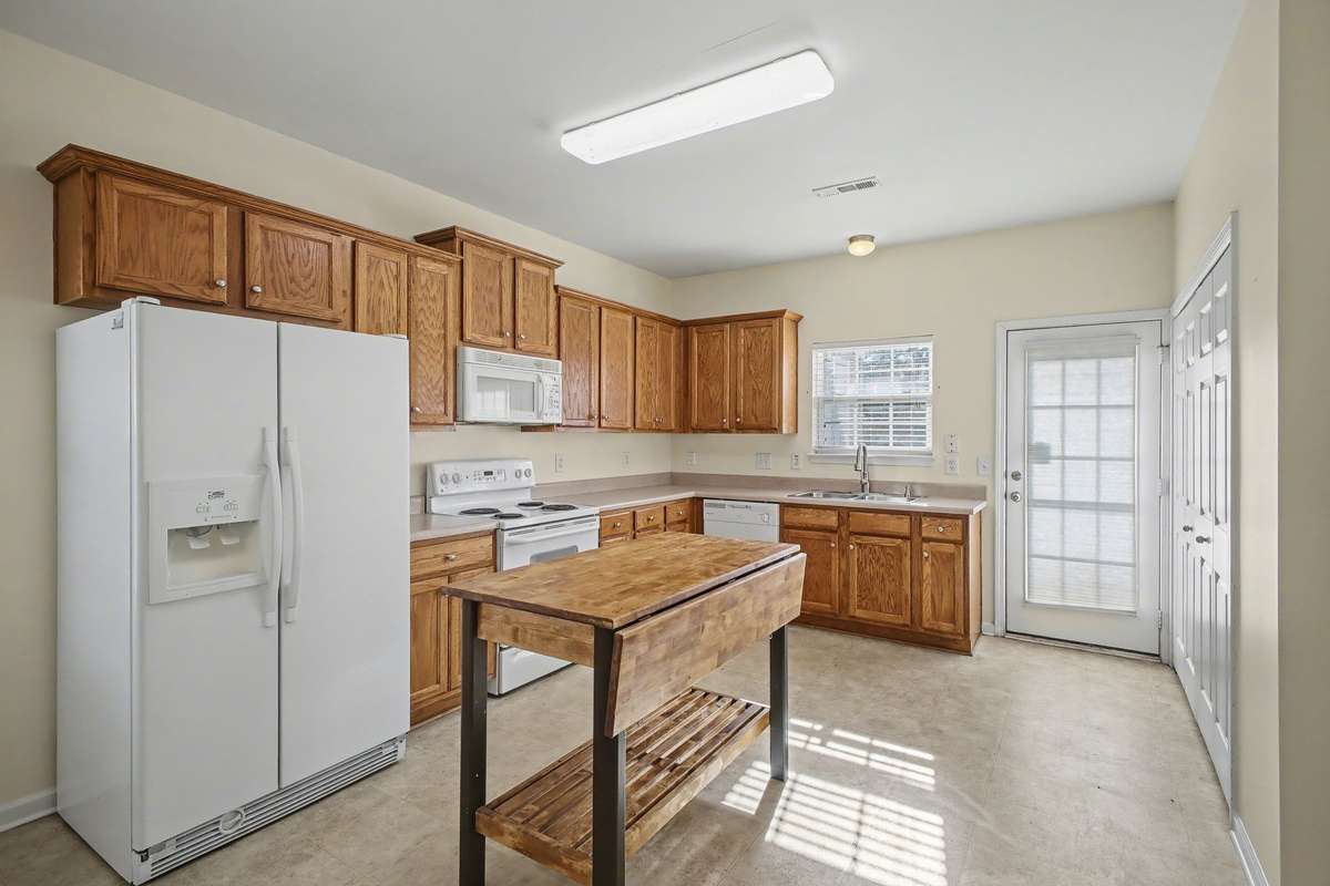 To the right is the utility room with washer/dryer and water heater.  Also, a separate pantry.