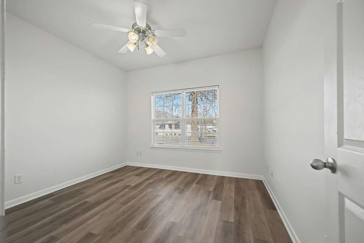 14x11 Primary Bedroom with ceiling fan.