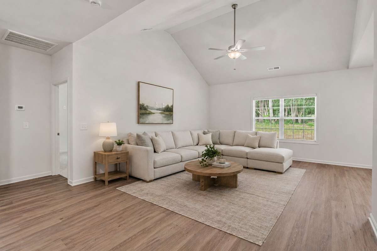 Photo of lot 8 with same floor plan but flipped. This image is virtually staged