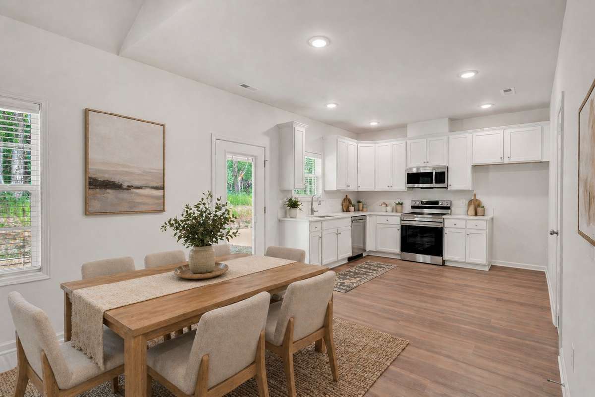 Photo of lot 8 with same floor plan but flipped. This image is virtually staged