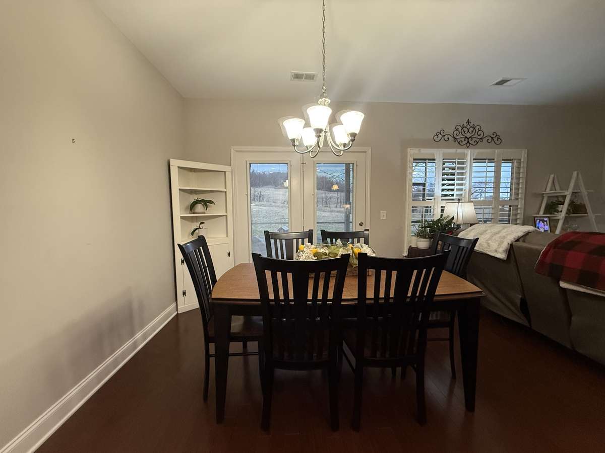 The kitchen is equipped with granite countertops and new stainless-steel appliances, including a gas range. A large laundry room and convenient drop zone sit just off the 3-car garage, while the spacious entry foyer provides an impressive welcome.