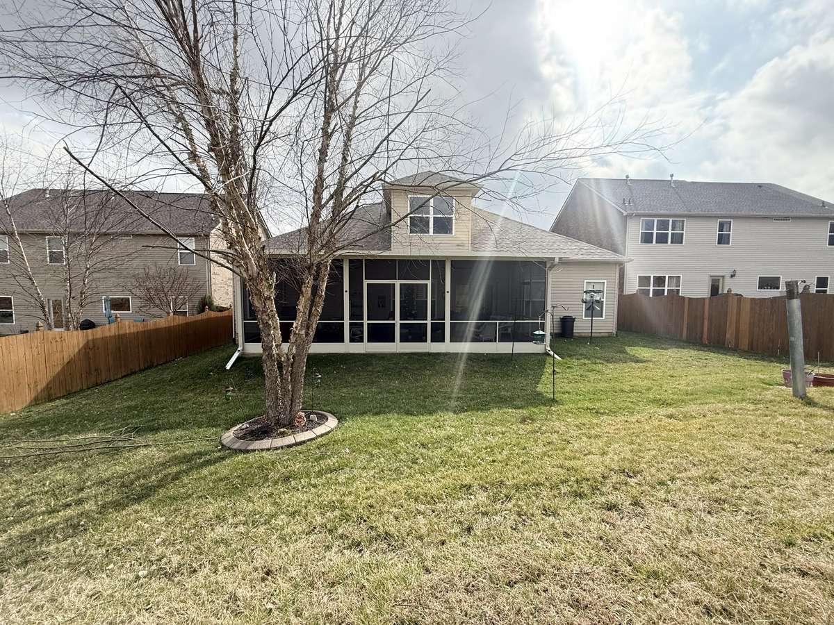 Beautiful screened back patio overlooking a nice spacious backyard with nothing behind property