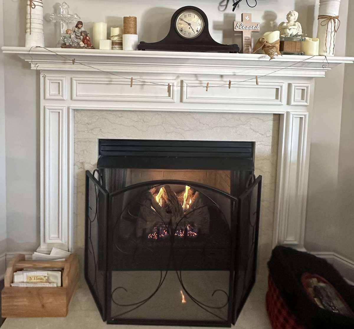 beautiful gas fireplace with a white mantle