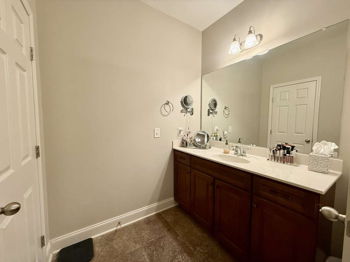 Retreat to the oversized Primary Suite overlooking the expansive backyard, complete with a walk-in shower, separate double vanities, and double closets.