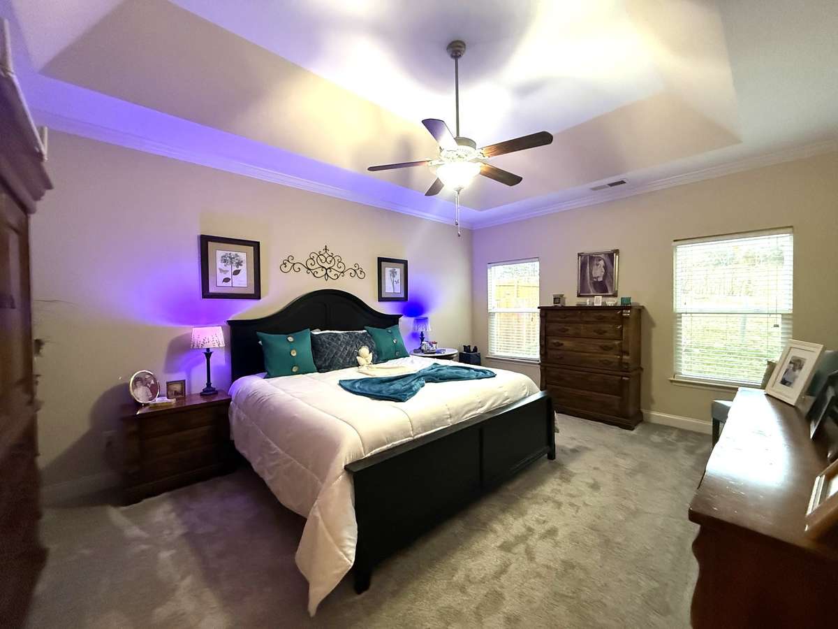 Hardwood, LVT, and carpet flooring, recessed lighting, and warm neutral tones enhance the home’s welcoming ambiance throughout. Primary Suite features large bath suite & walk in closet
