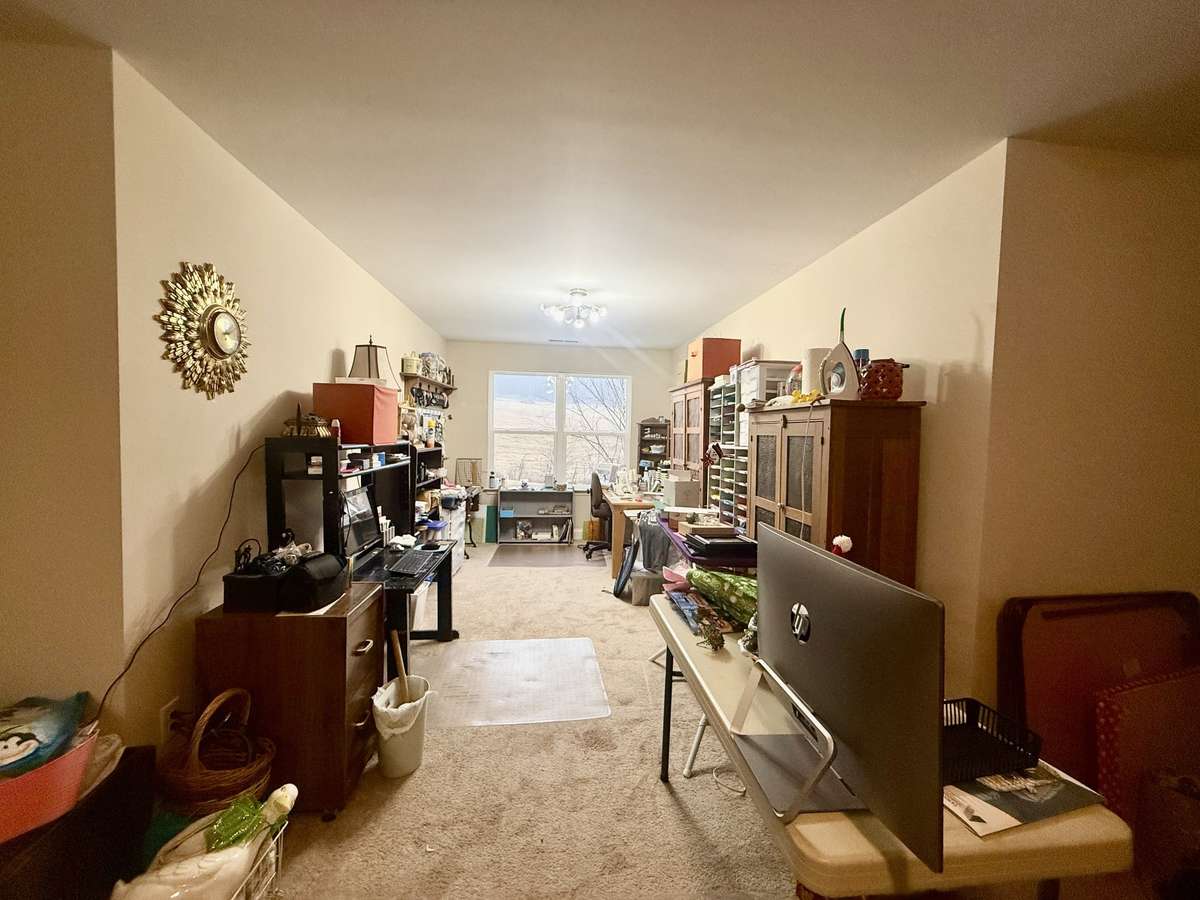 generous 25x25 flex room or fourth bedroom upstairs—perfect for a home office, media room, or guest retreat. has a walk-in closet