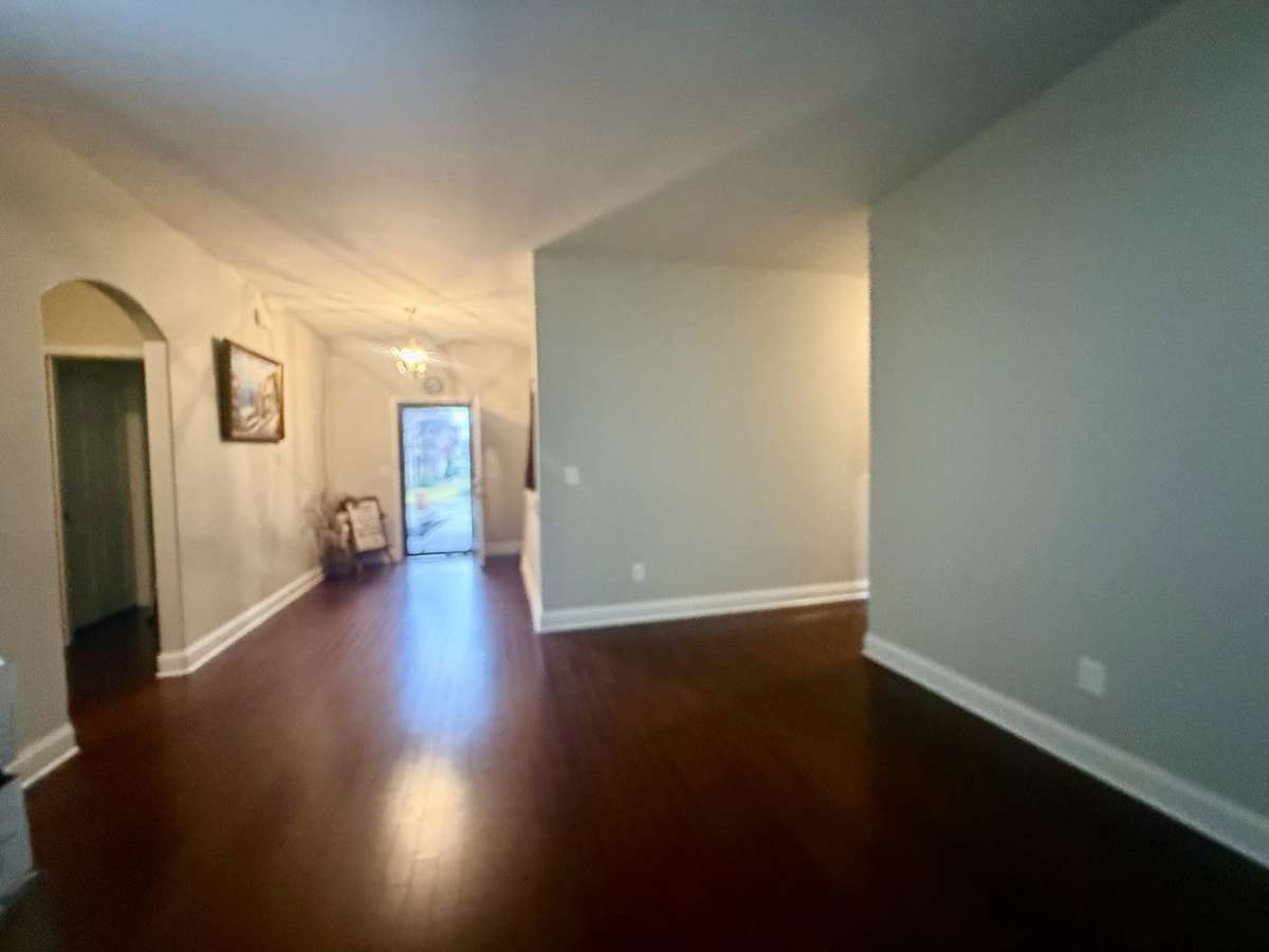 Large Sitting area off the Entry Foyer leading into the Living Room
