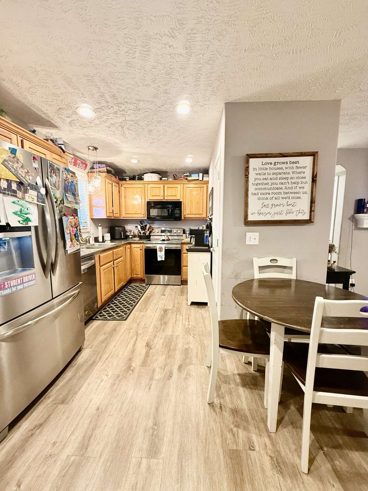 Kitchen with SS appliances; Pantry Closet; flows into the Living Room;