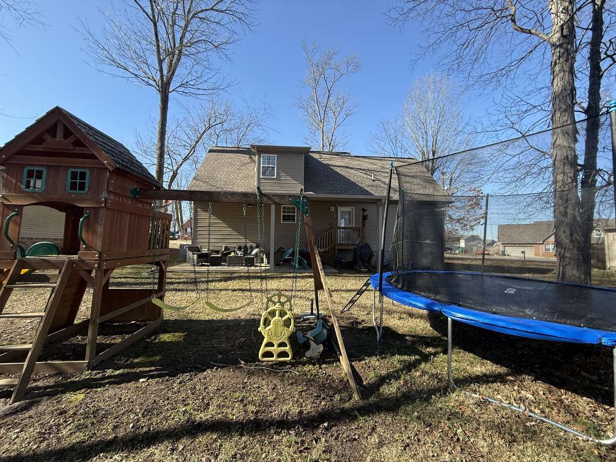 Nice backyard for playset etc; Enjoy the outdoors while relaxing on the covered patio