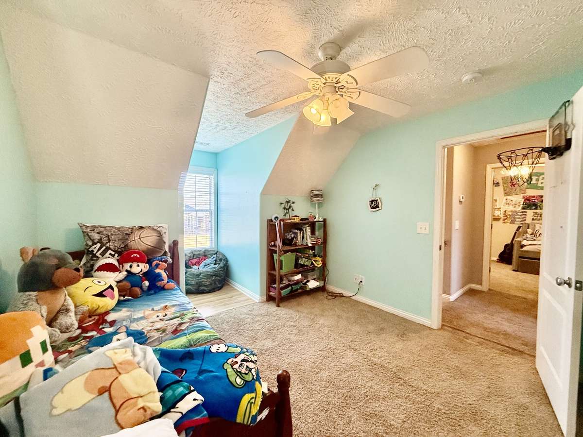 Upstairs Bedroom #2 with large closet; Knook area great for sitting or study area; carpet and ceiling fan