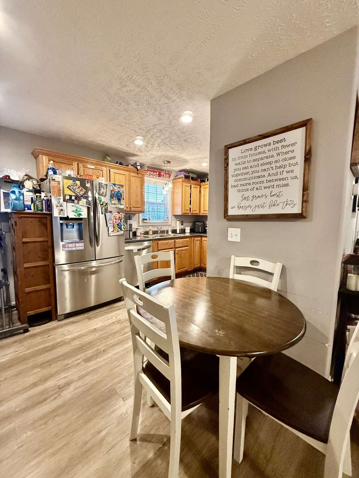 Kitchen Eat-in area with laminate flooring; SS appliances; Kitchen window overlooking covered patio & backyard.