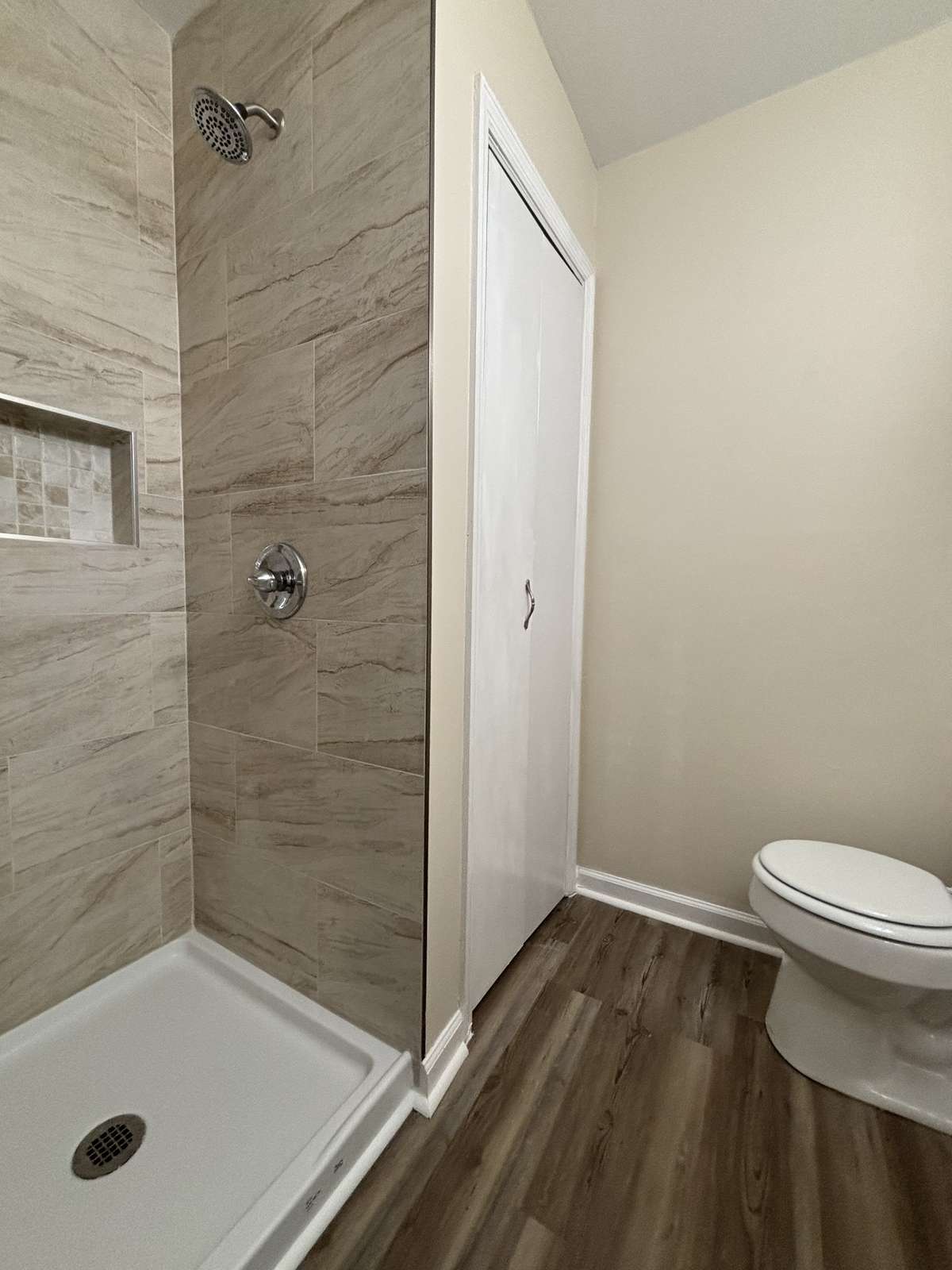 Primary Bedroom Bathroom with Tiled Shower
