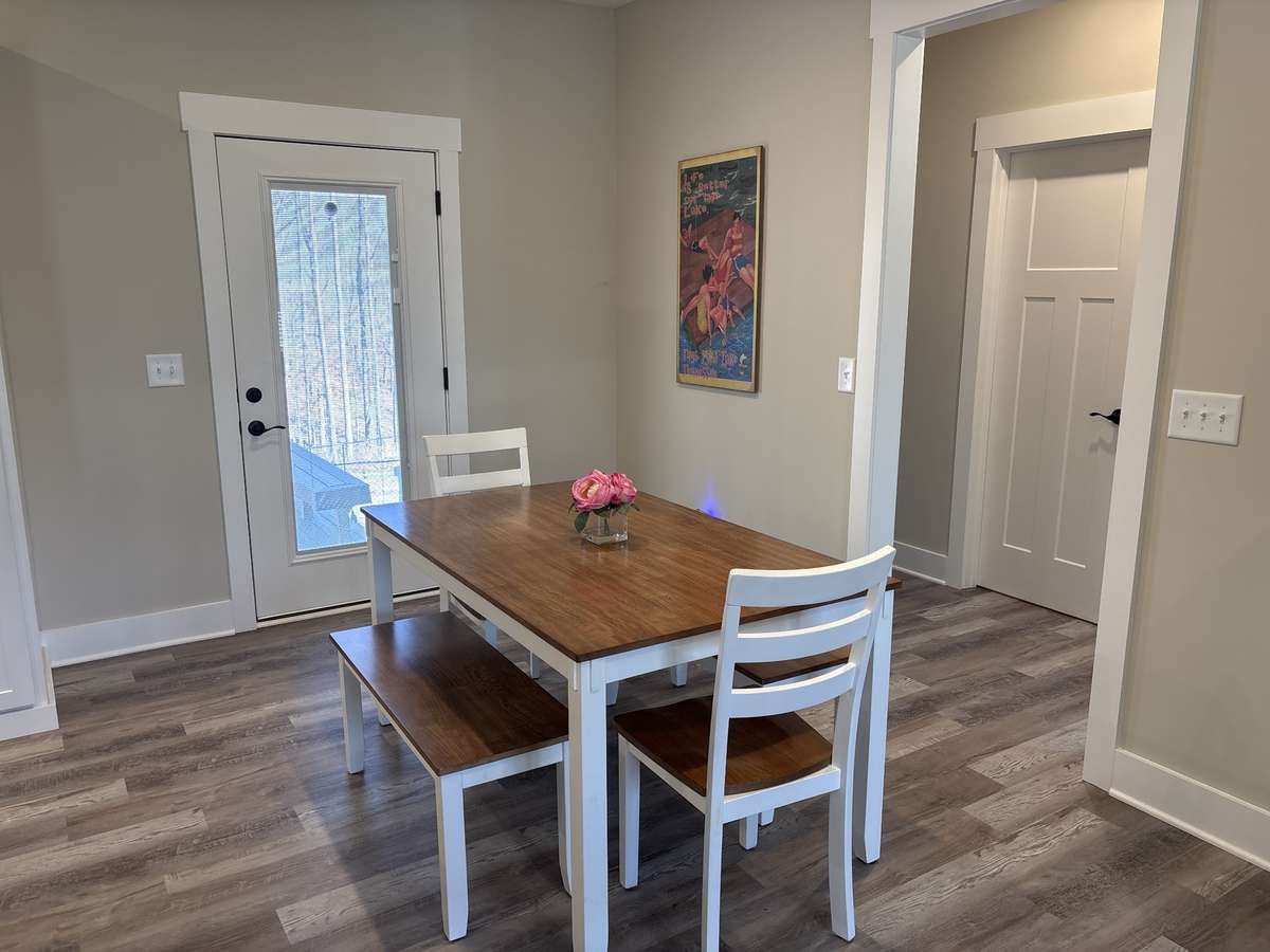 Dining Area has Back Door & Access to Back Porch & Deck
