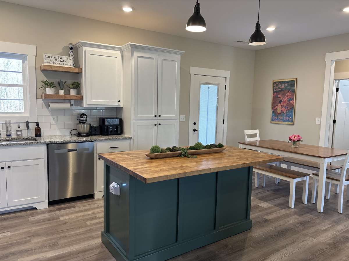 Kitchen has Large Kitchen Island, Dining Area and Recessed Lighting