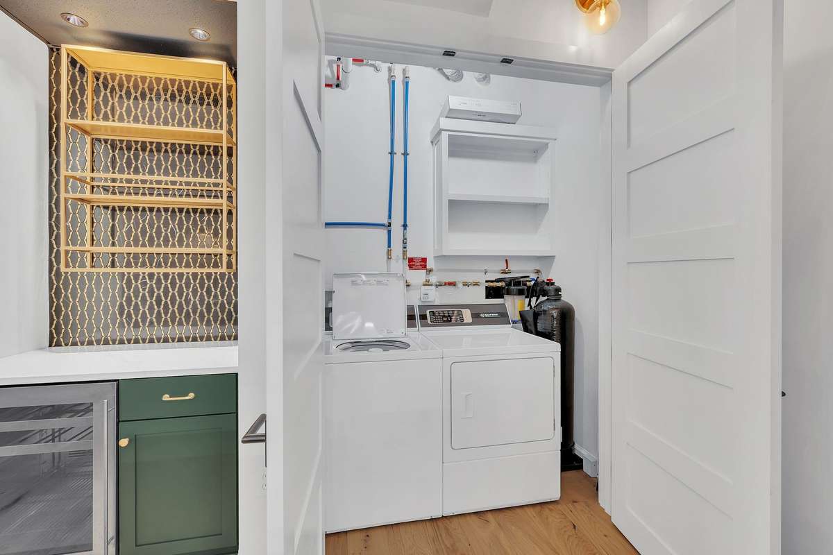Washer/dryer with whole unit water filtration system and tankless water heater all custom fitted into your entry closet
