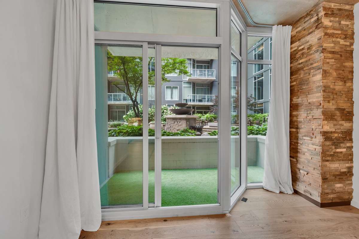 Enjoy the calming fountain just outside your unit. This area of the courtyard is rarely used so you have this corner of the development to enjoy. Also, enjoy a quick walk around the corner to use the outdoor grills.