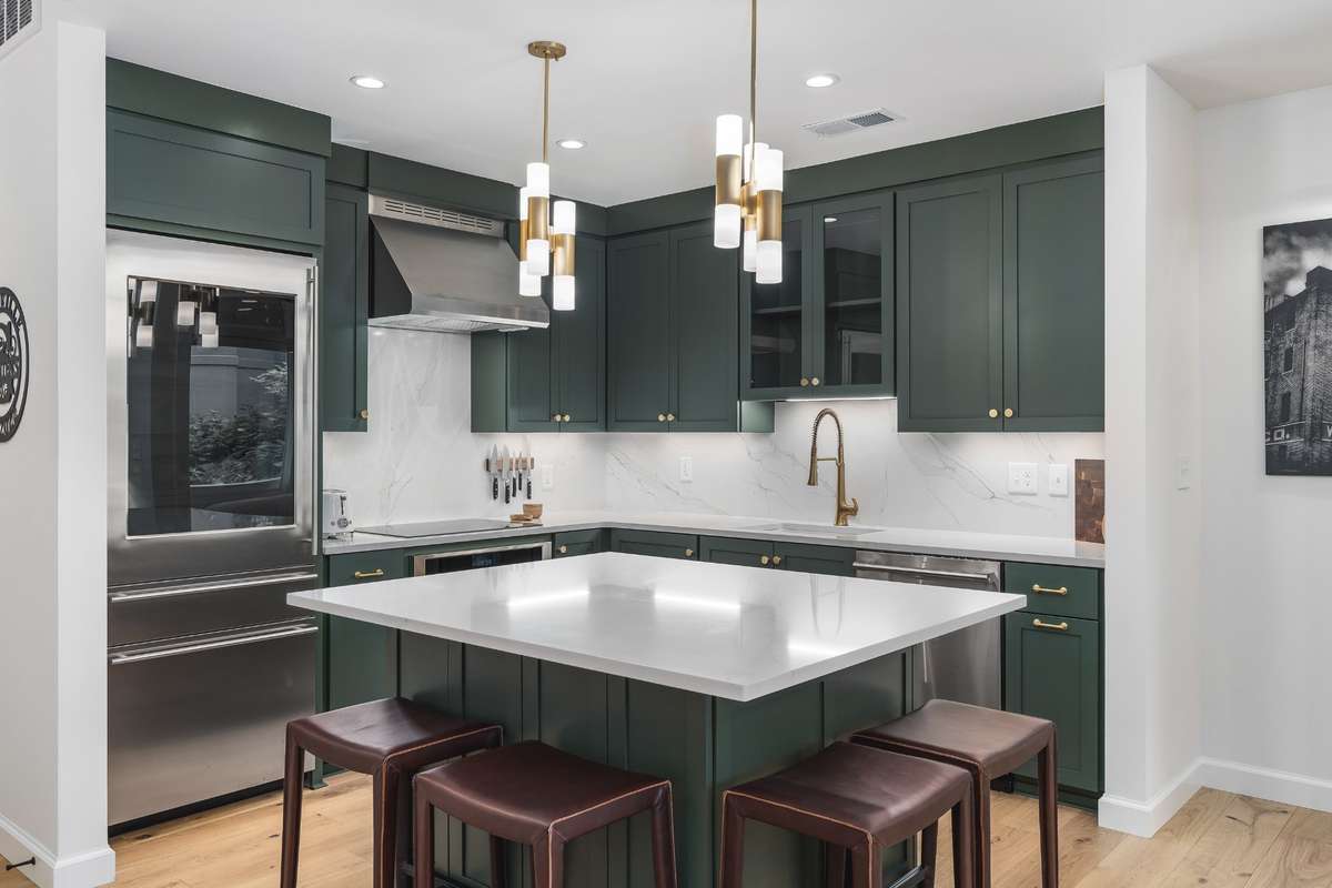 Plenty of room at the kitchen island for gathering for drinks and dining or taking care of daily tasks
