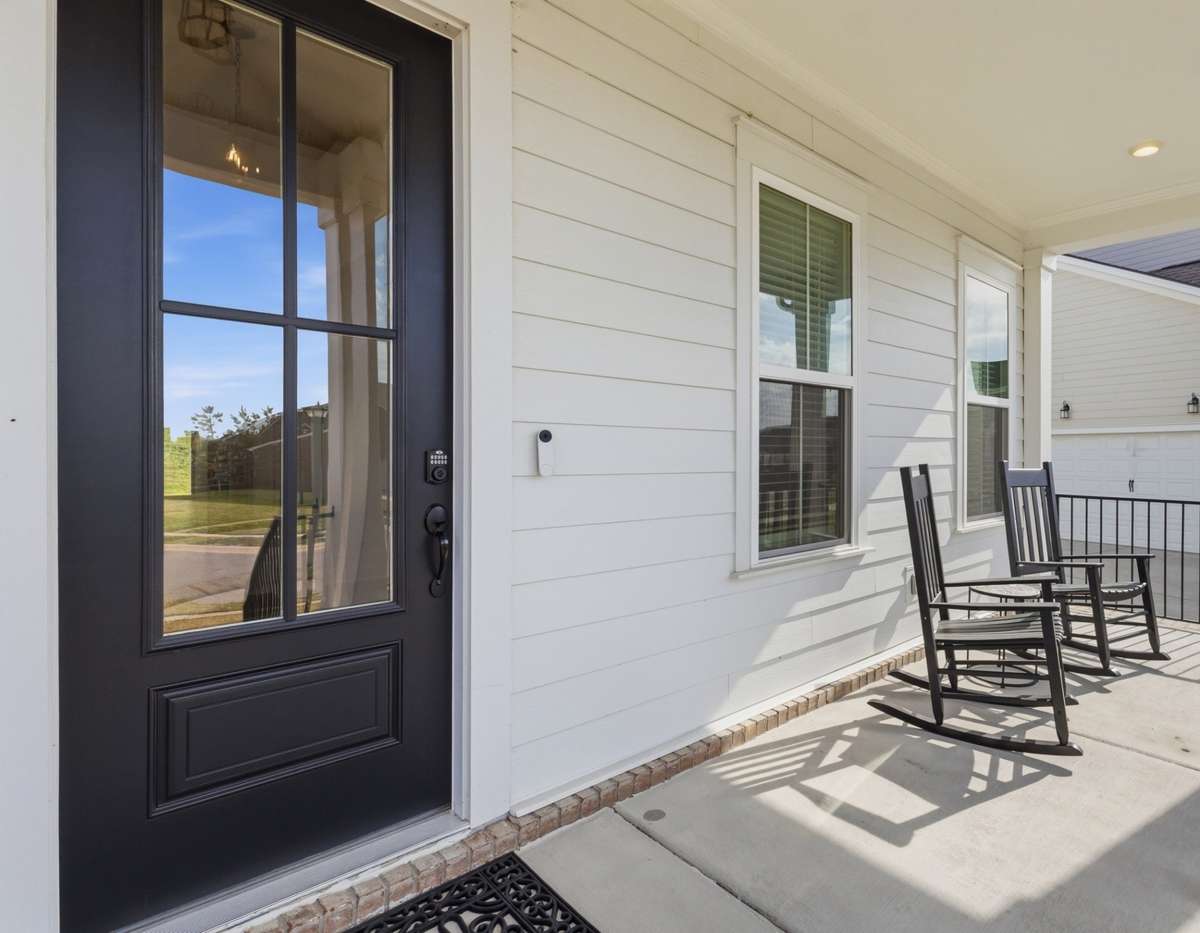 Enjoy your covered front porch and not looking directly at a neighboring home.