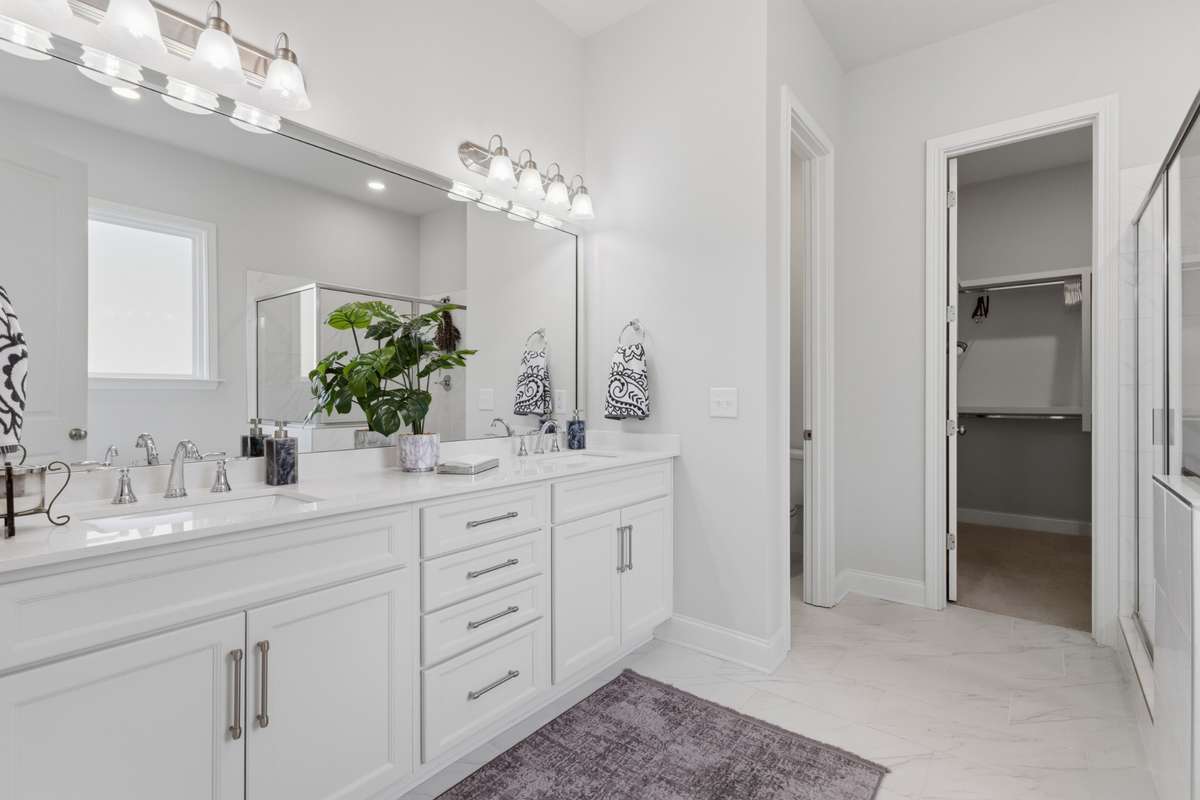Primary bath features raised height double vanity.