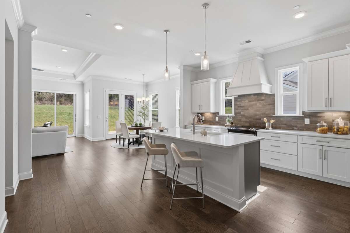 Living areas open to the outside with a wall of doors that open to the backyard.