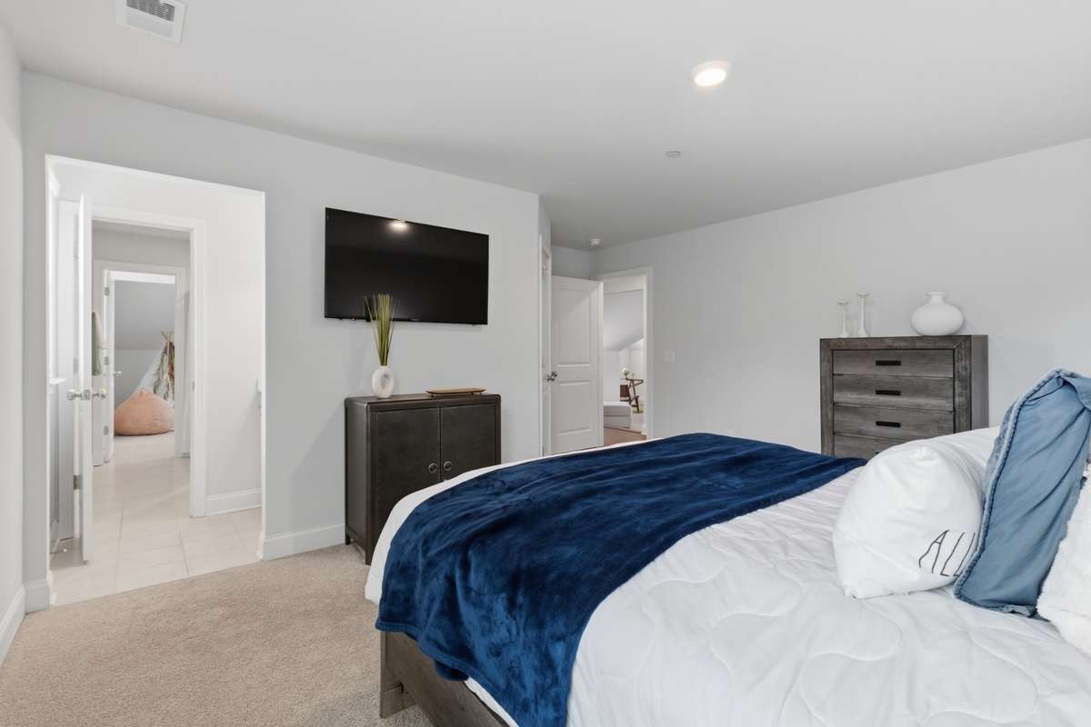 Bedroom 2's view towards the shared bath and separate vanity.  Bonus room is across from Bedrooms 2 & 3.