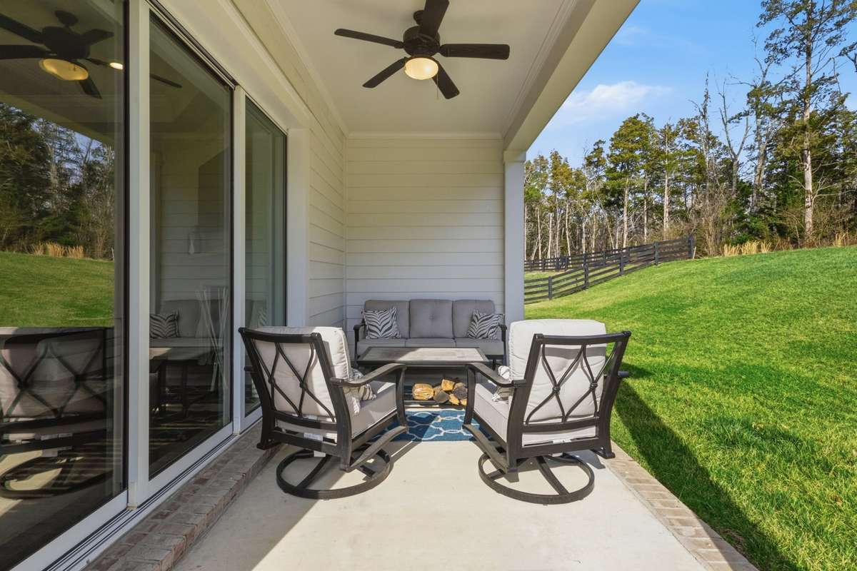 Covered patio opens completely to the great room.