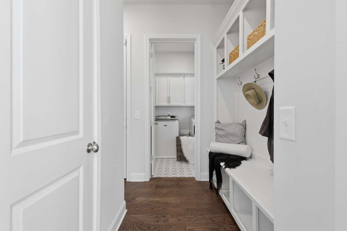 Powder room is adjacent to the mudroom and laundry.