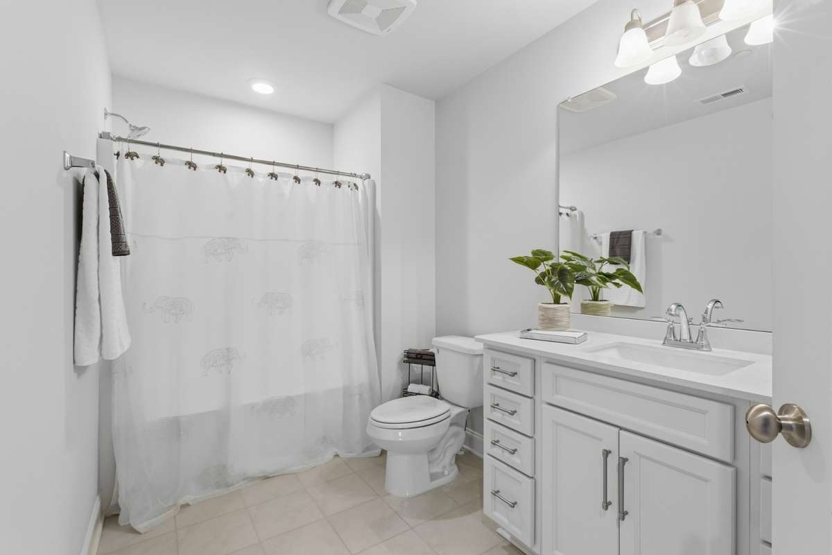 Bedroom 4's bath.  Bath opens to landing to allow for bonus room access.