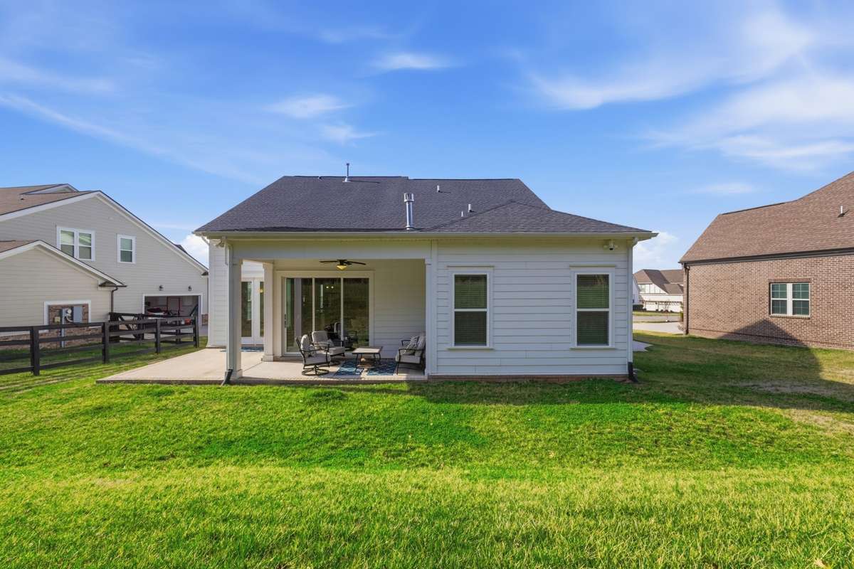 Back view of 628 Dunmeyer Court. Fully-irrigated lawn.