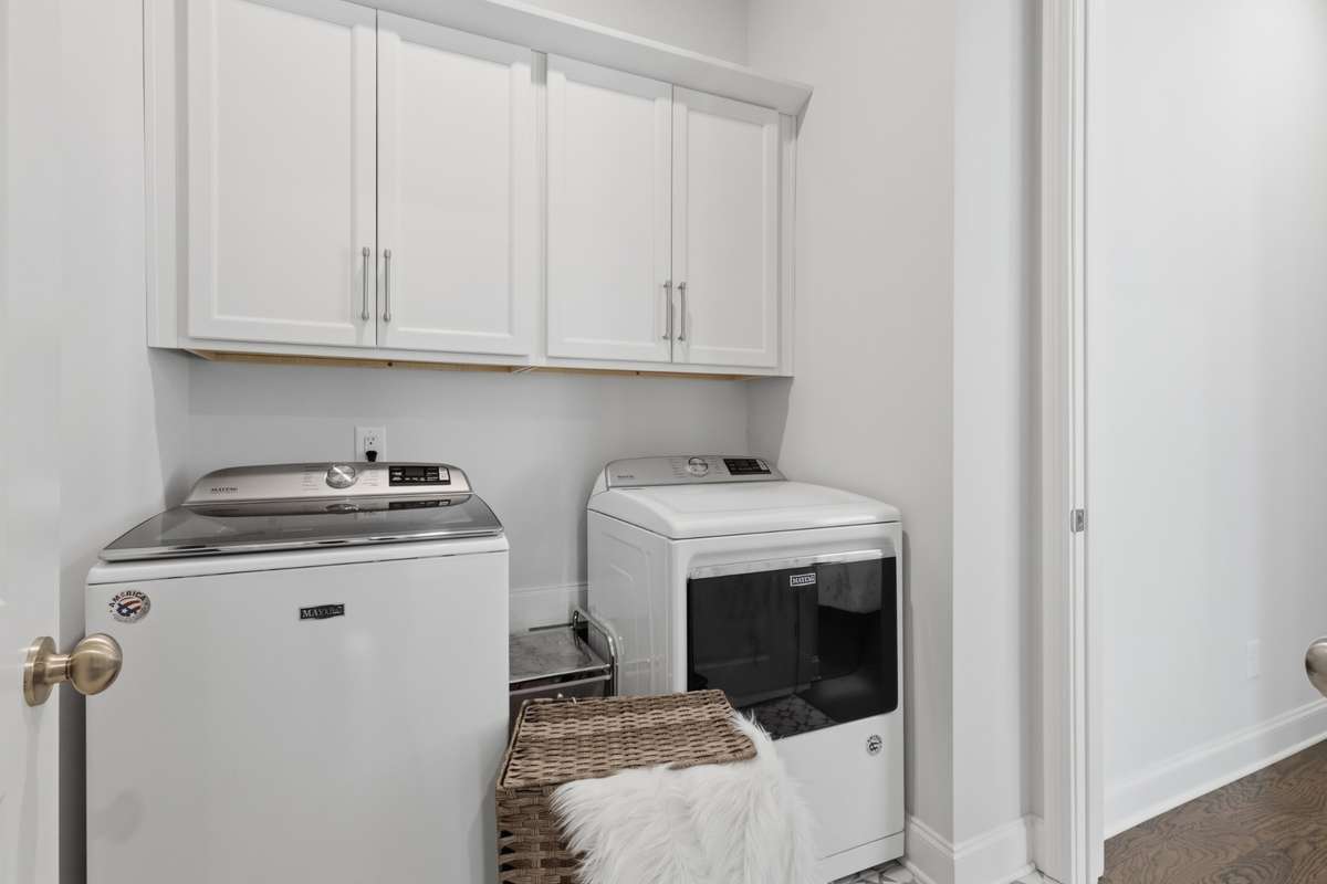 Laundry room is also directly across from the primary bedroom.