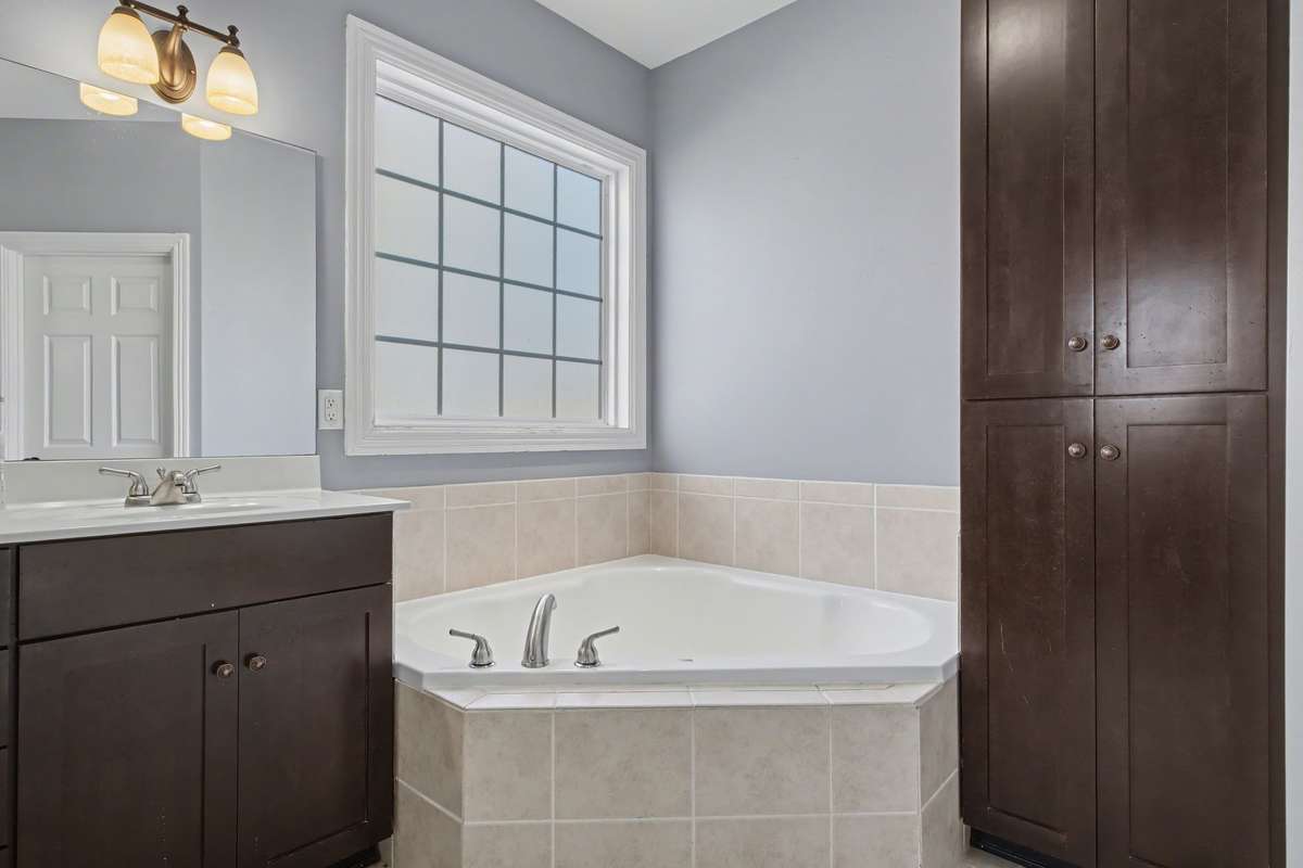 Large Soaking Tub, Linen Closet, and separate shower!