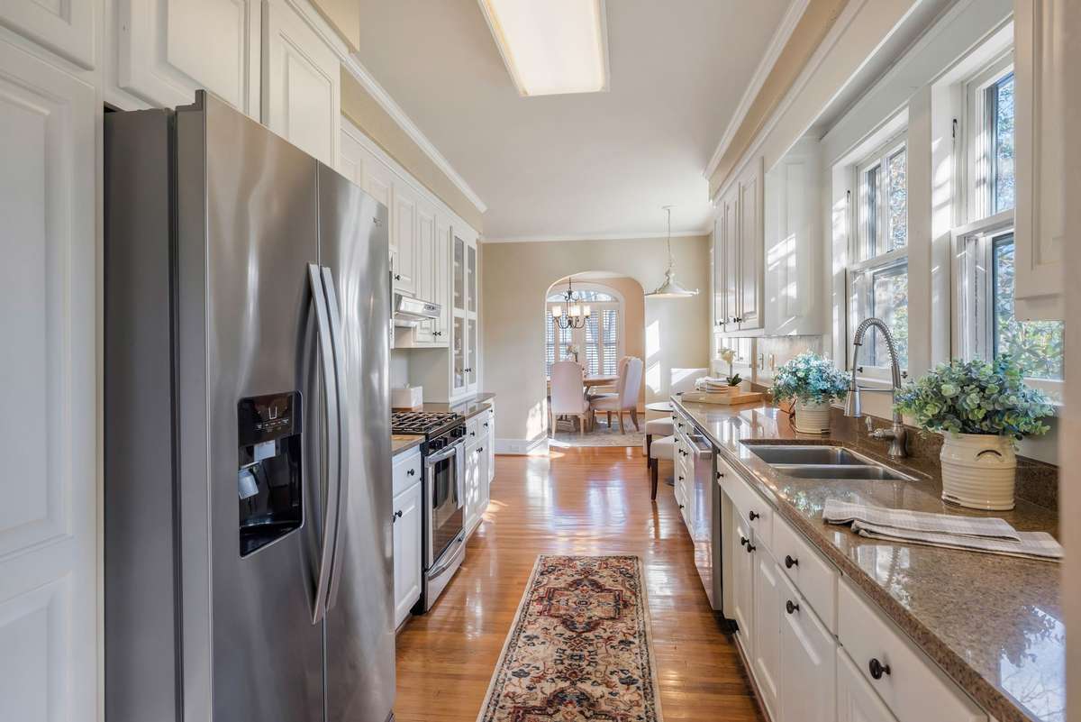 Stainless Steel Appliances and Abundant Natural Light Streaming into the Kitchen