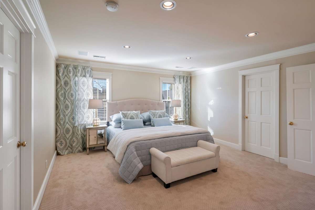 Primary Bedroom w Two Walk-In Closets