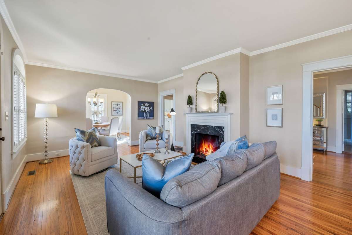 Spacious Living Room flows easily to Dining Rm and Kitchen as well as Central Hallway 9’ Ceilings
